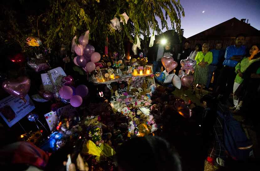 People gather at a memorial for Sherin Mathews on Sunday.