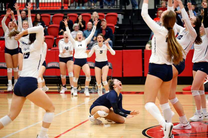 Flower Mound High's Sarah Martinez (center) and her teammates celebrate the final point of...