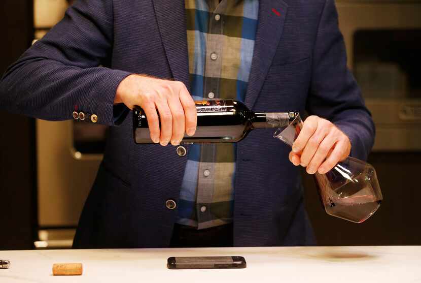 James Tidwell demonstrates how to pour when decanting wine.