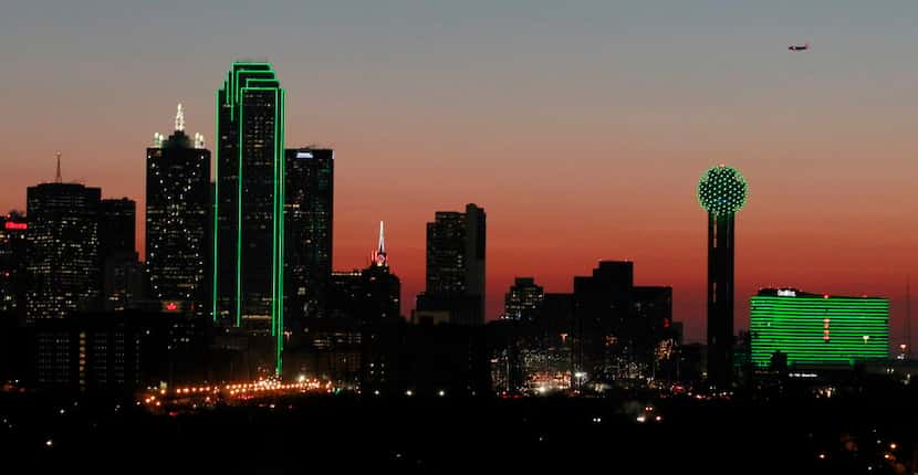 Several buildings in downtown Dallas are lit in green to celebrate Saint Patrick's Day on...