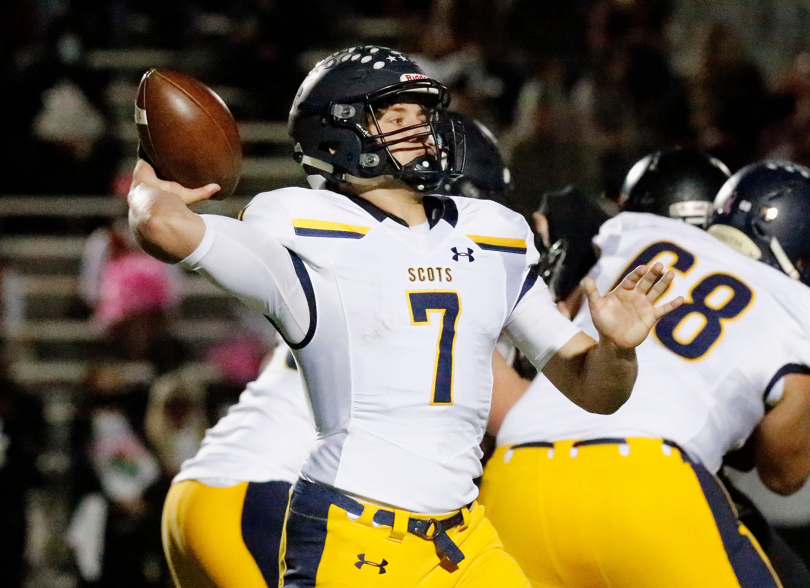 Highland Park High School quarterback Brennan Storer (7) throws a pass during the first half...