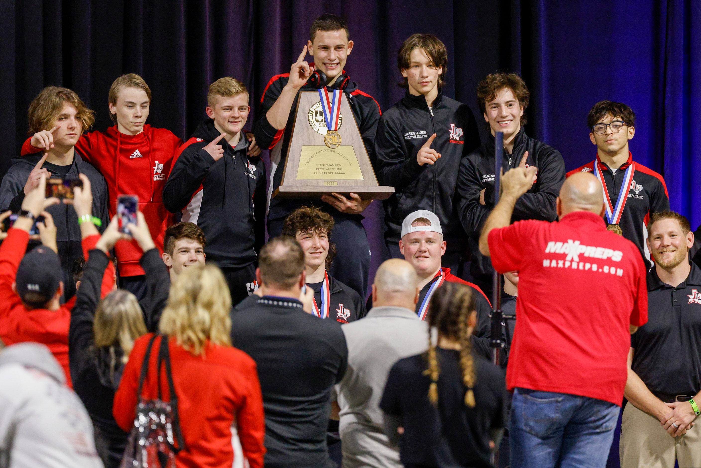 Members of the Lucas Lovejoy team pose for photos with the boys 5A team state championship...