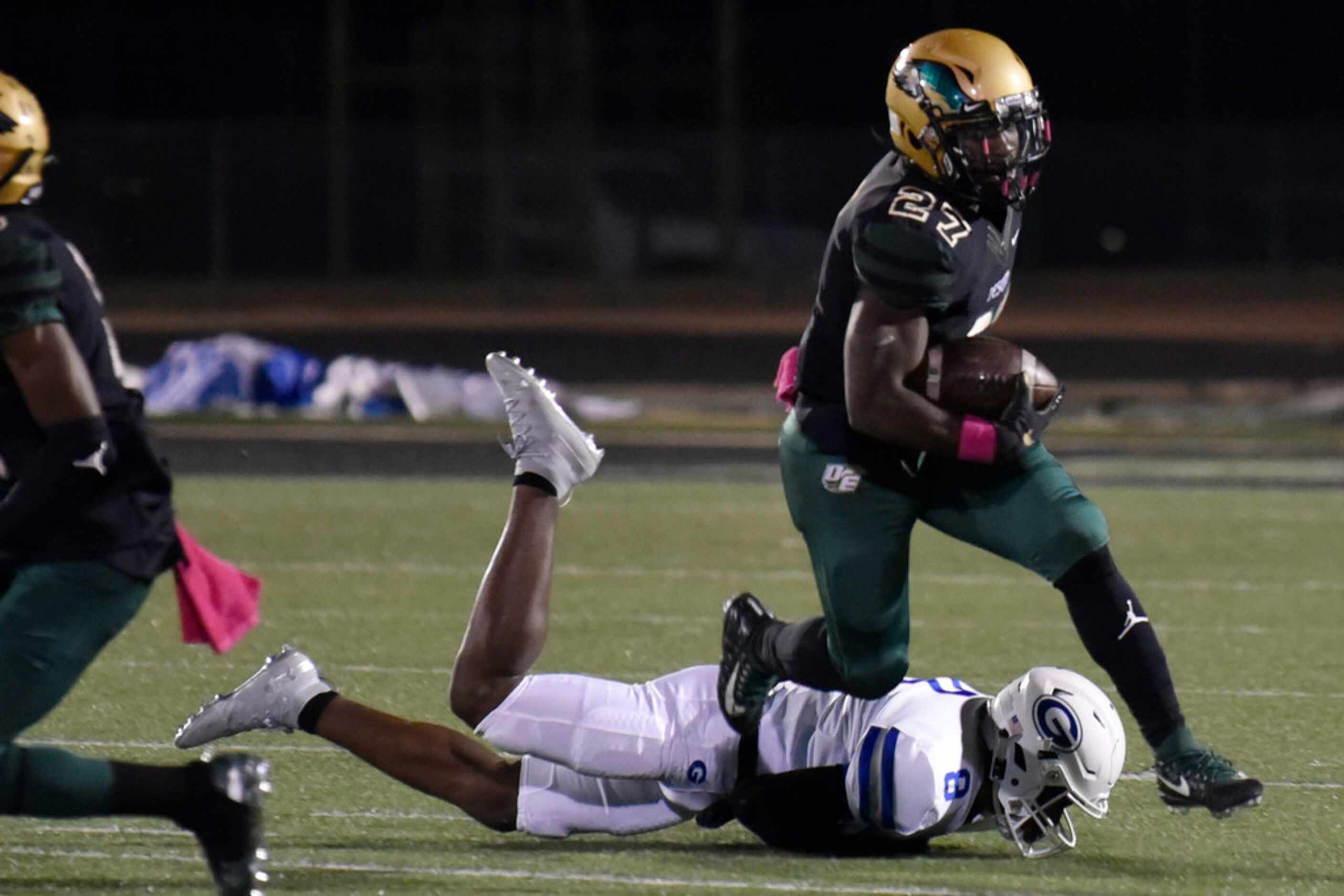 DeSoto High School senior running back Joshua Jackson (27) runs over Grand Prairie High...