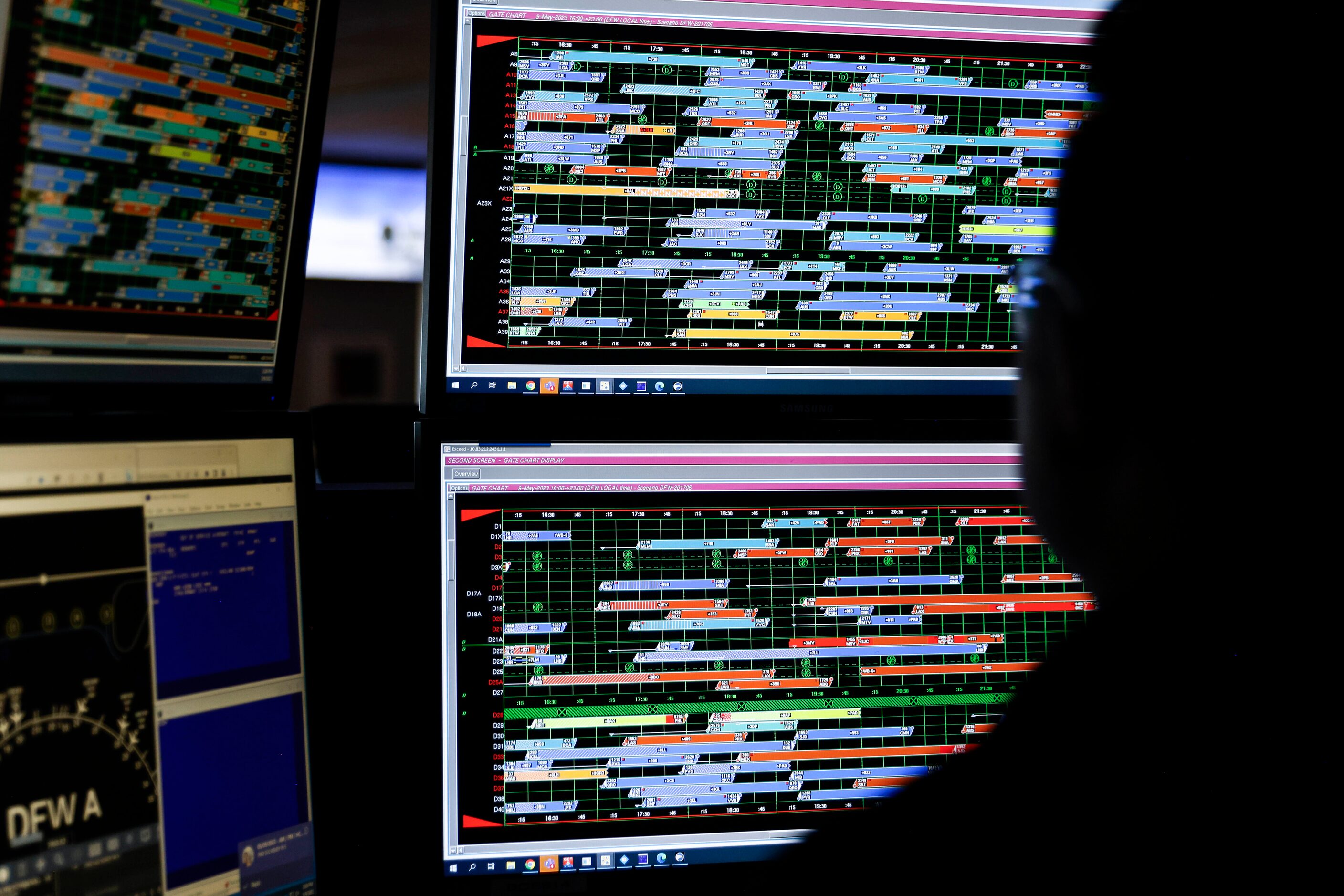 Athipong Yimsiriwattana, American Airlines fleet service agent, works in front of a screen...