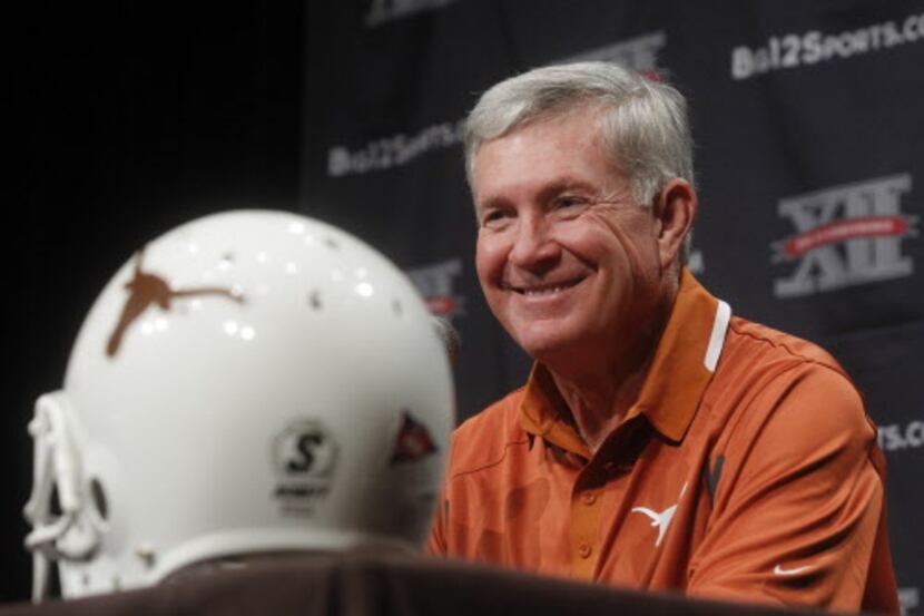 Texas football coach Mack Brown speaks during the Big 12 media days at the Omni Hotel in...