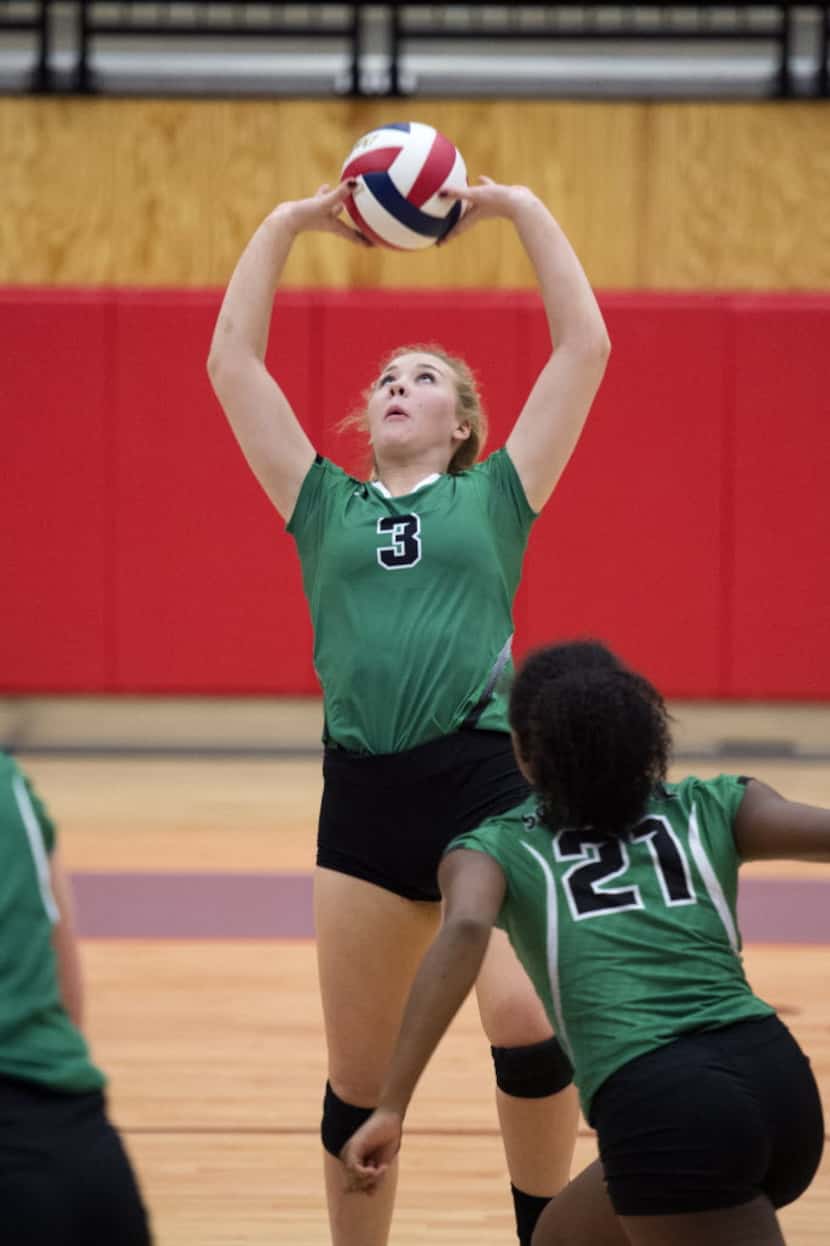 Southlake Carroll junior setter Sheridan Webb sets the ball during a playoff volleyball game...