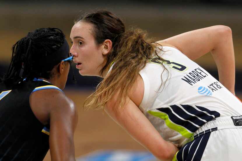Dallas Wings guard Marina Mabrey (3), right, keeps the ball from Chicago Sky guard Diamond...