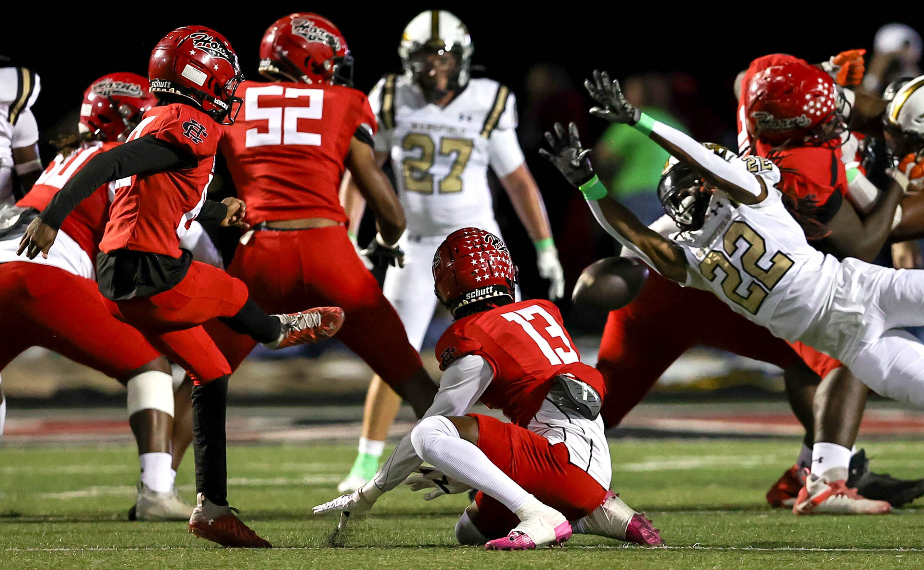 Mansfield's Hezekiah Womack (22) blocks the extra point attempt from Cedar Hill kicker...