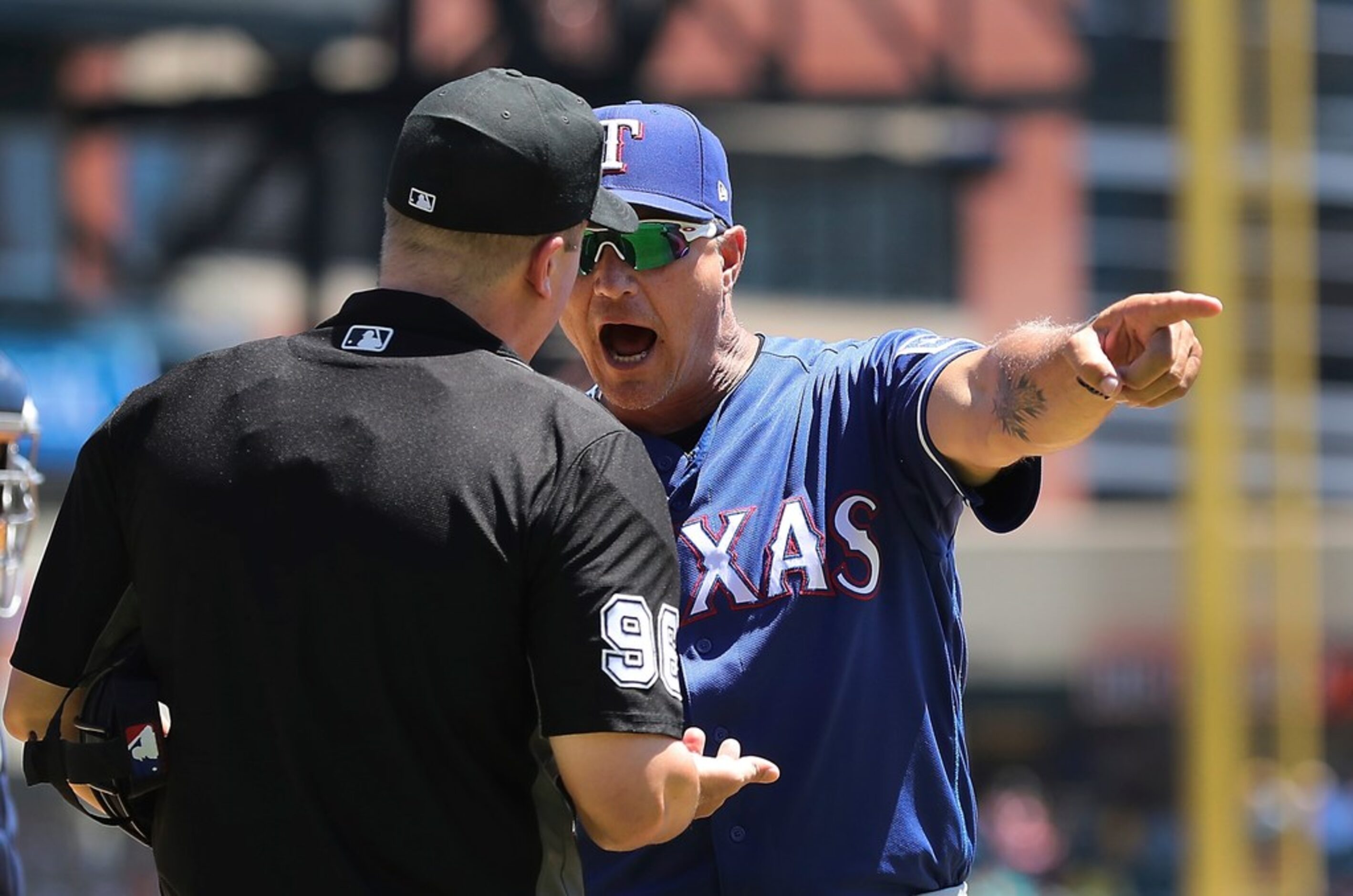 Texas Rangers manager Jeff Banister argues, right, with home plate umpire Chris Segal during...