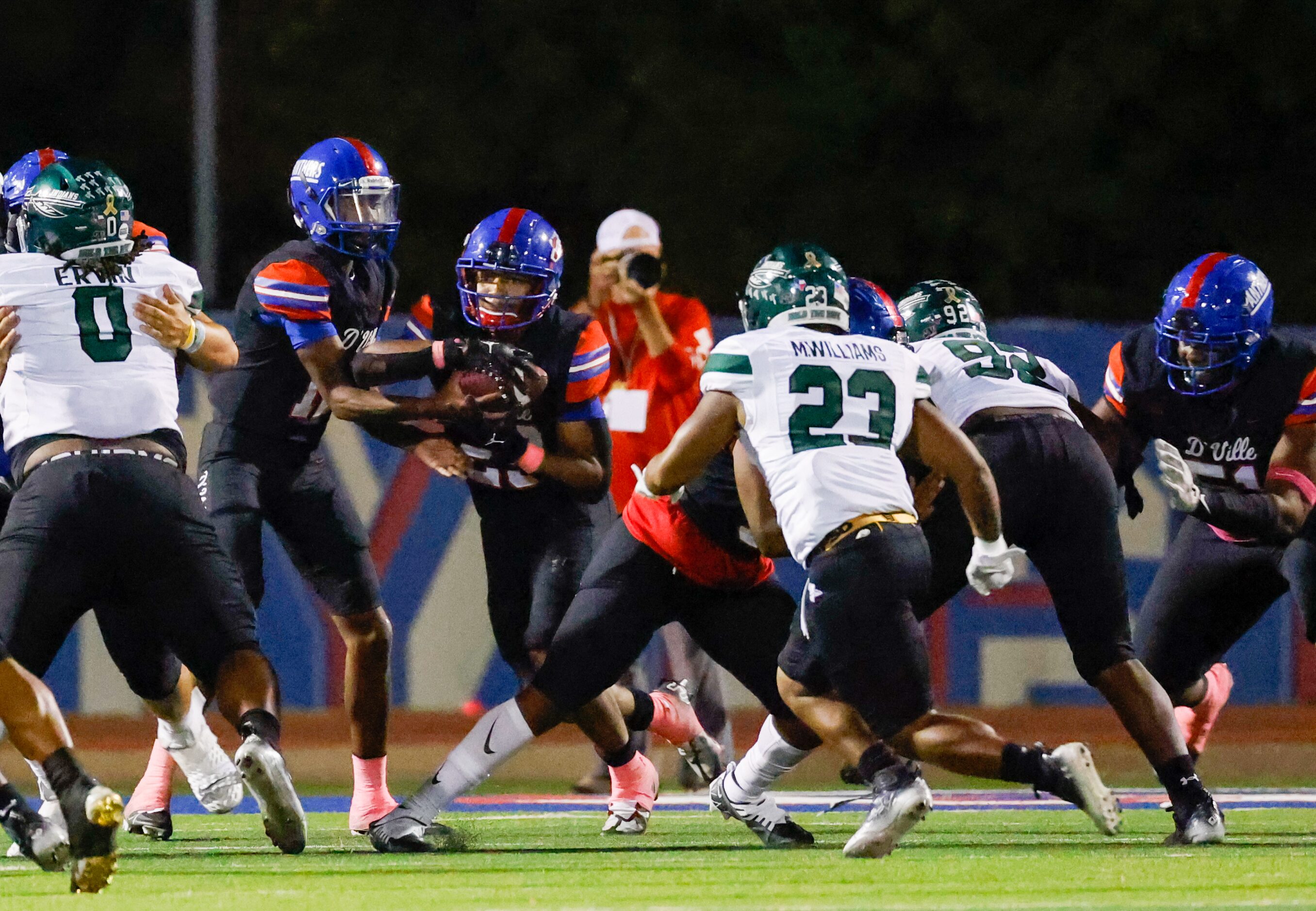 Duncanville running back Caden Durham (29) takes a hand off from Duncanville quarterback...