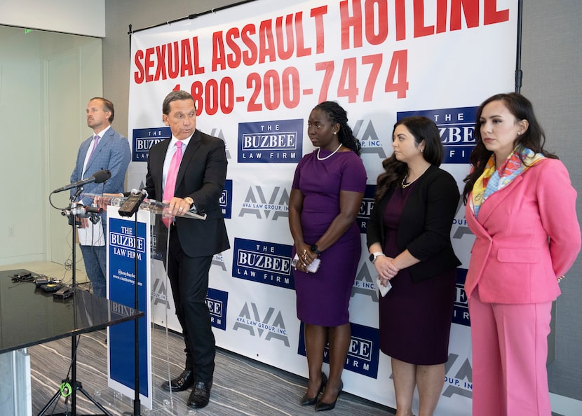 Houston lawyer Tony Buzbee, second from left, holds a news conference at his office...