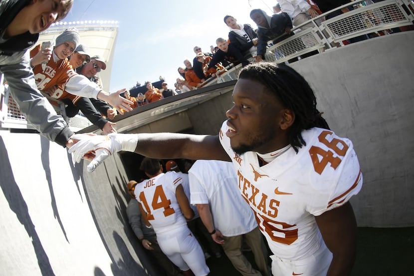 WACO, TX - OCTOBER 28: Malik Jefferson #46 of the Texas Longhorns celebrates with a fan...