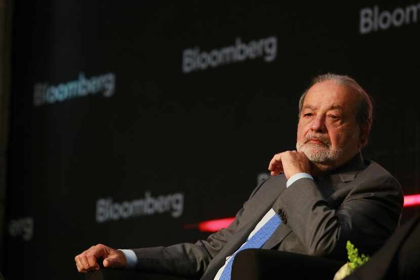 Billionaire Carlos Slim, chairman emeritus of America Movil SAB, listens during the...