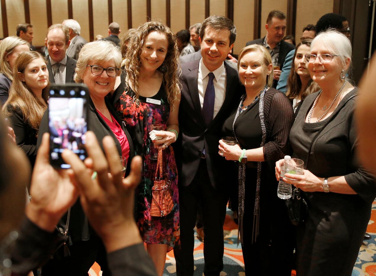 Presidential candidate and South Bend mayor, Pete Buttigieg takes a group photo at a...