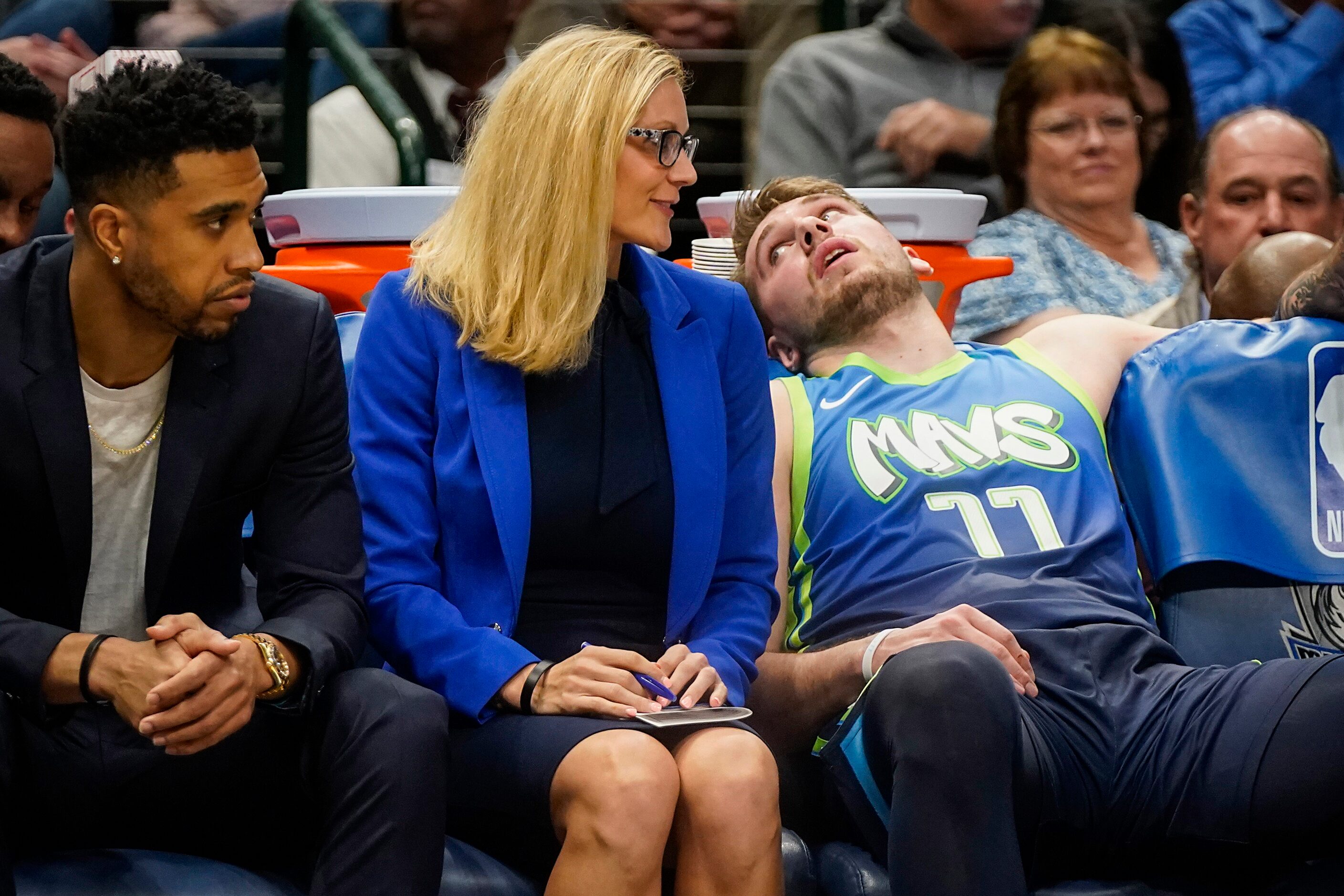 Dallas Mavericks guard Luka Doncic (77) gets a breather on the bench during the second half...