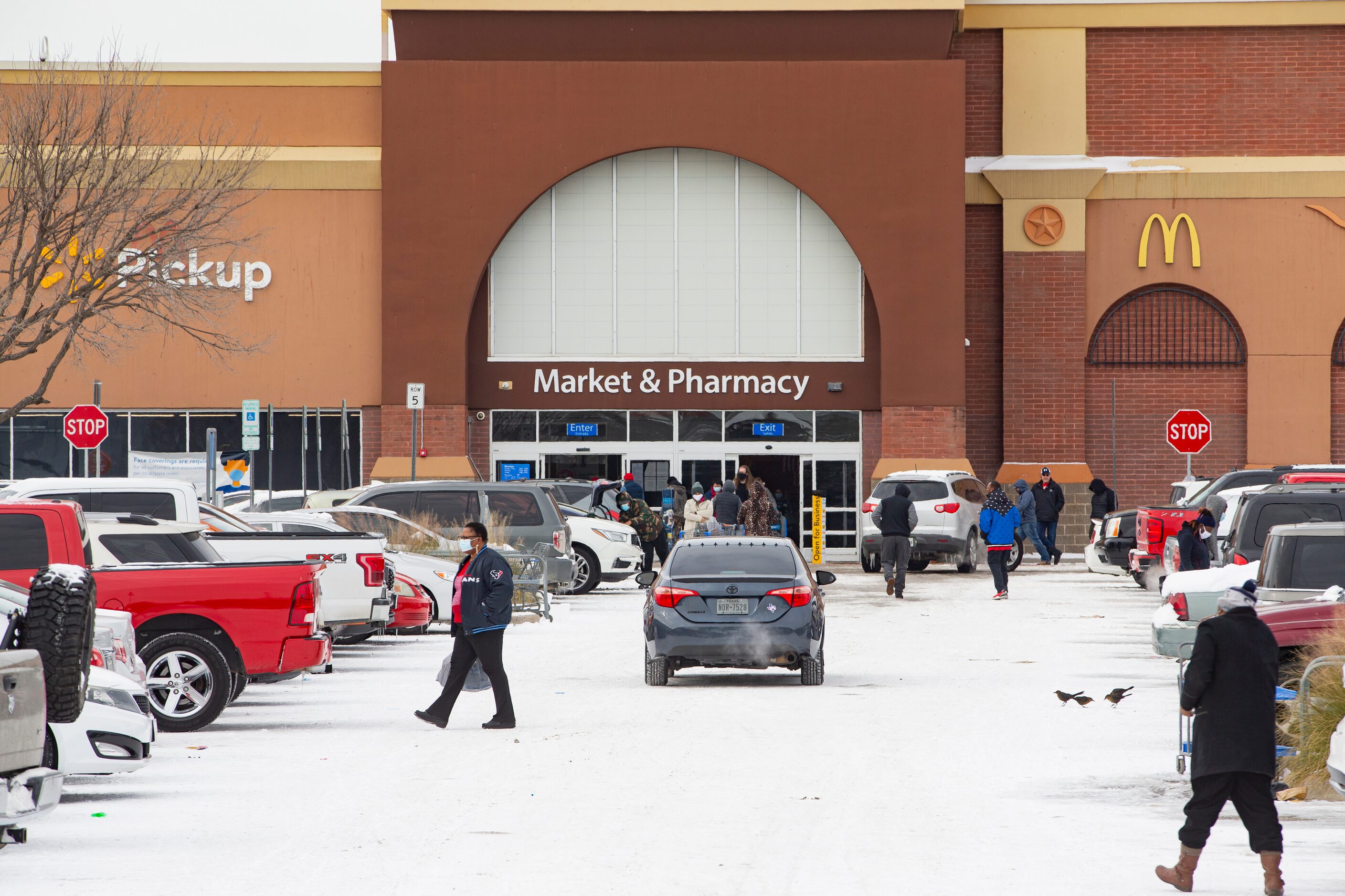 People outside of the Walmart in Arlington on Tuesday, Feb. 16, 2021. (Juan Figueroa/ The...