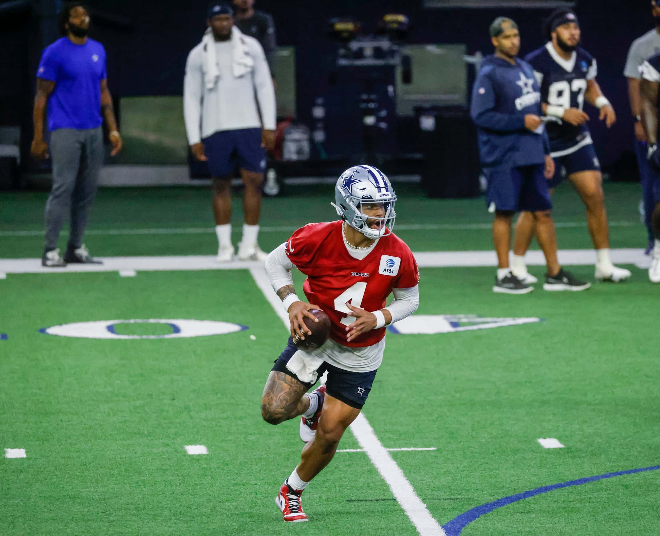Dallas Cowboys quarterback Dak Prescott runs with he ball during OTA practice on Thursday,...