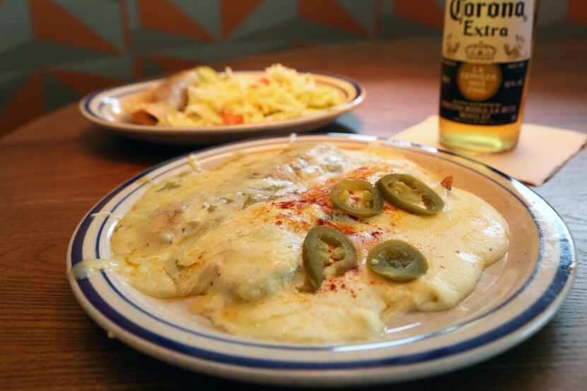 The Rudy's Special at Tupinamba's has a chicken enchilada with green sauce, beef sour cream...