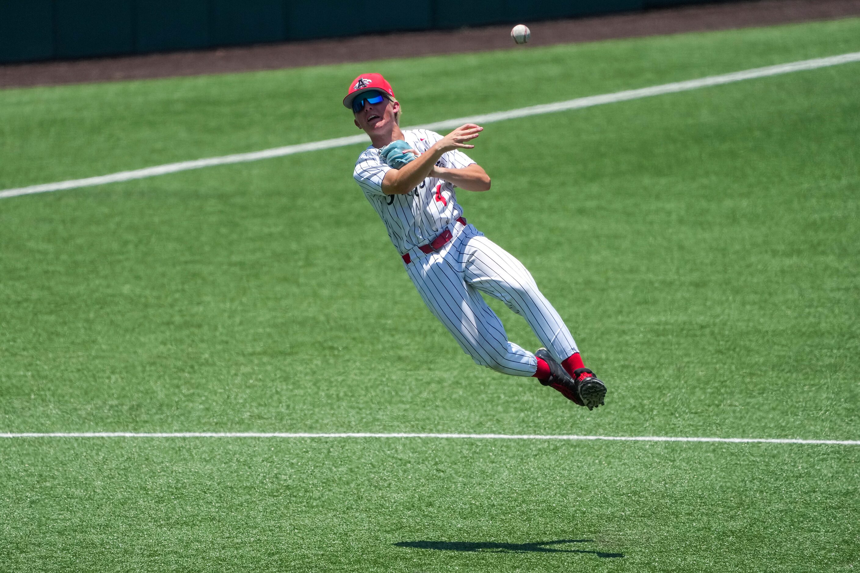 Argyle shortstop JC Davis makes an off balance throw during the third inning of a UIL 4A...