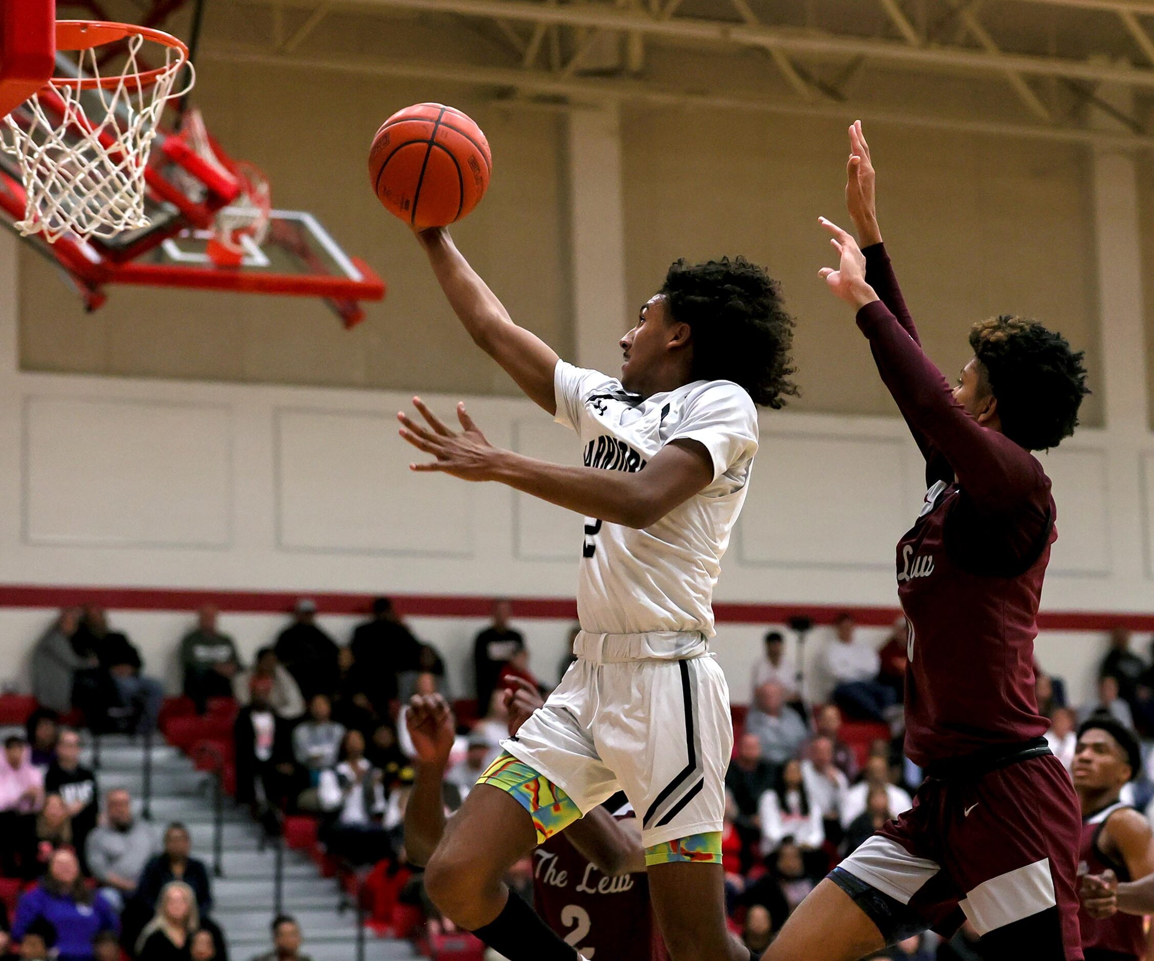 Arlington Martin guard Jaden Juarez (2) goes strong to the basket against Lewisville guard...