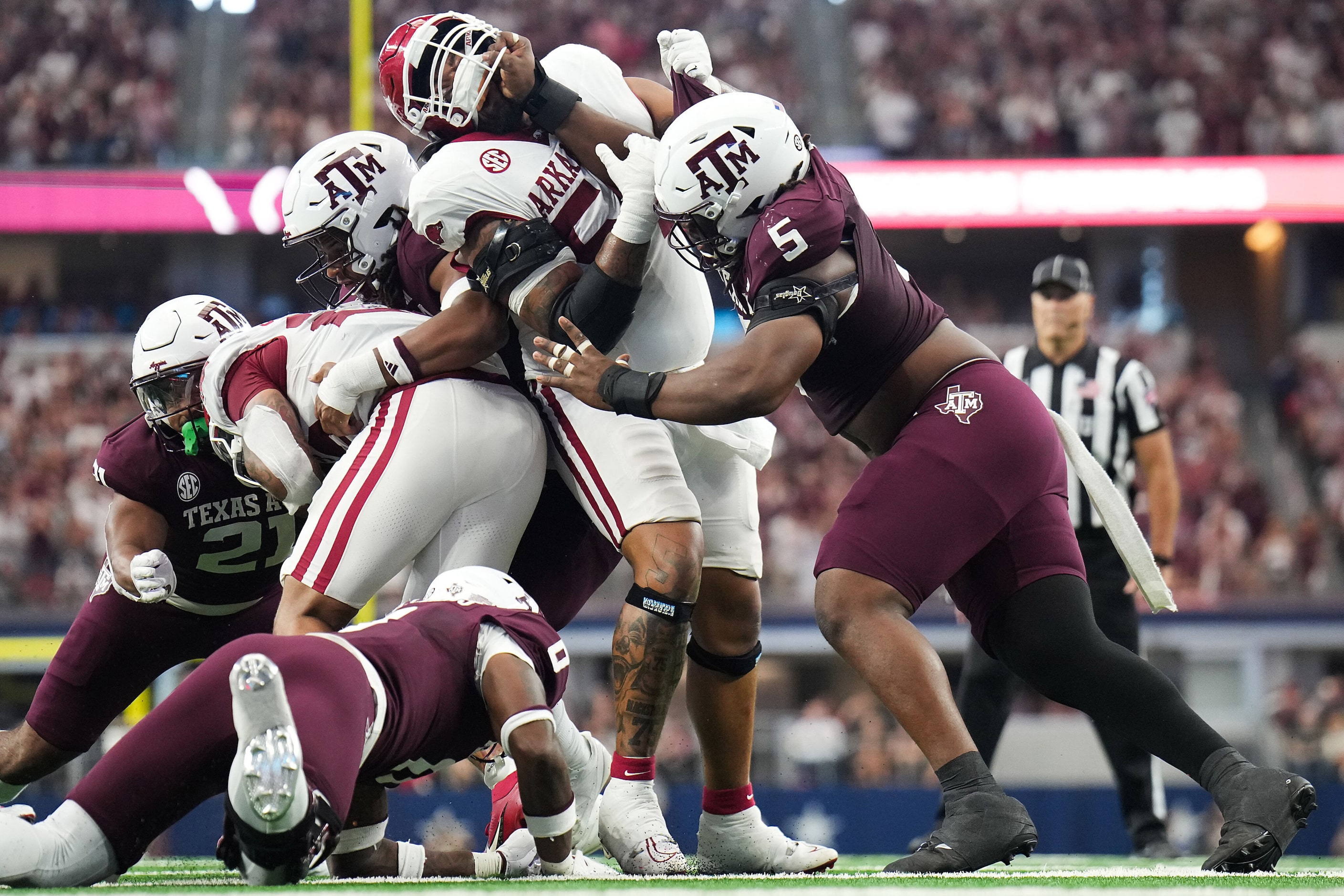 Arkansas running back Ja'Quinden Jackson (22) is brought down by the Texas A&M defense as...