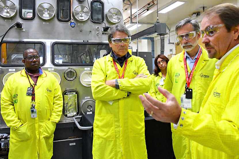 FILE- In this May 10, 2017, file photo, U.S. Secretary of Energy Rick Perry, second from...