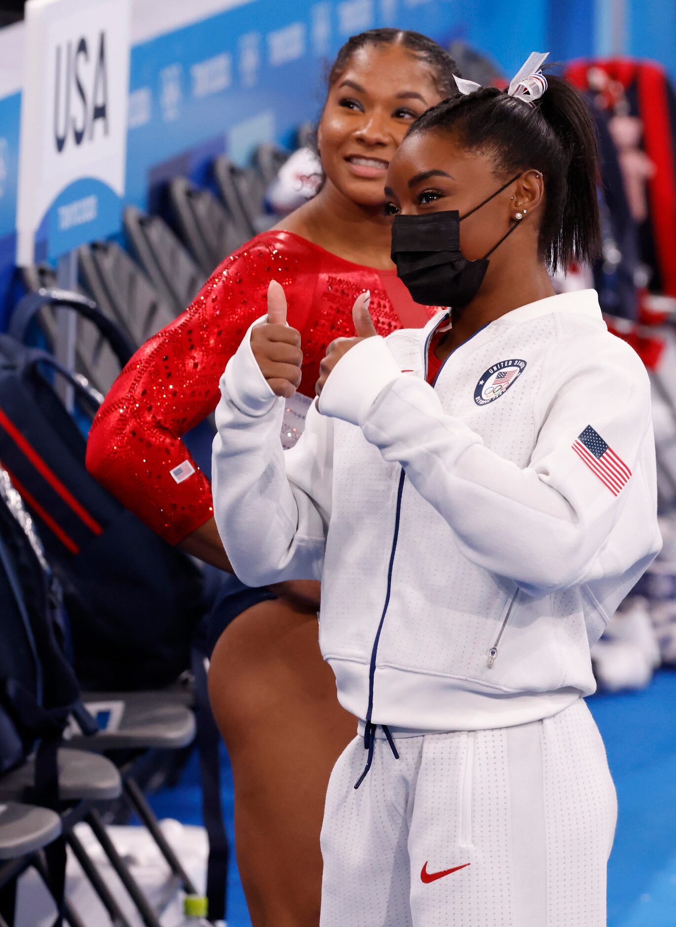 USA’s Simone Biles gives a thumbs up to Hoda Kotb from NBC during the artistic gymnastics...