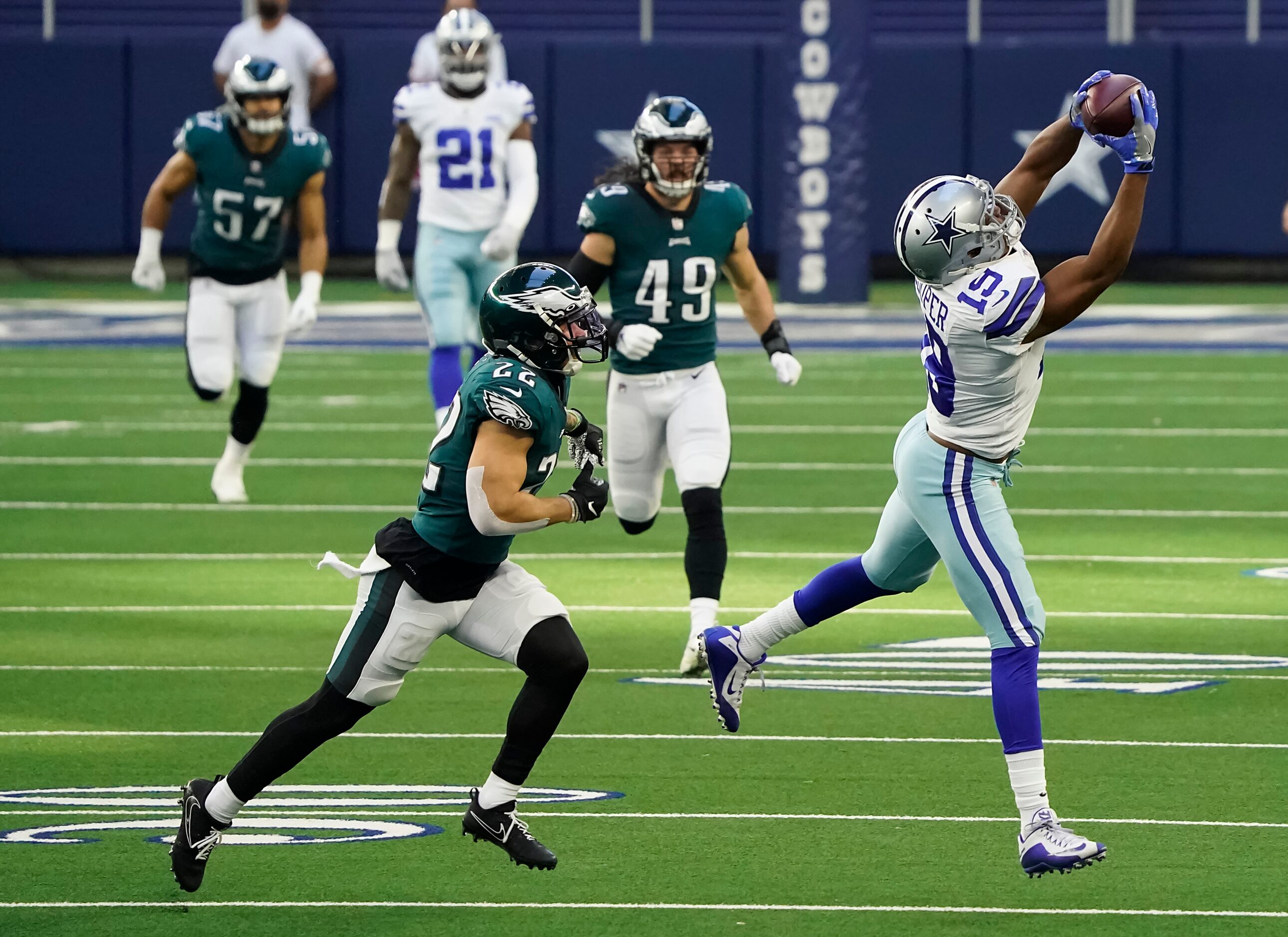 Dallas Cowboys wide receiver Amari Cooper (19) hauls in a long pass against Philadelphia...