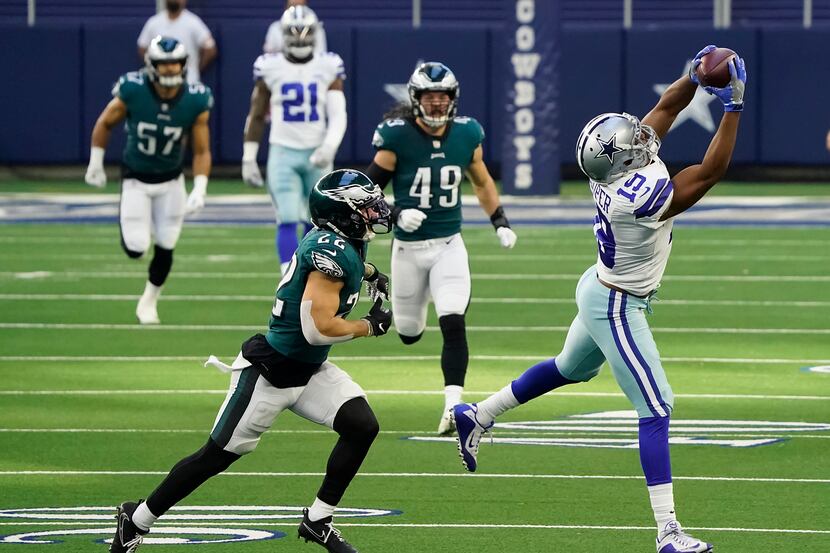 Dallas Cowboys wide receiver Amari Cooper (19) hauls in a long pass against Philadelphia...