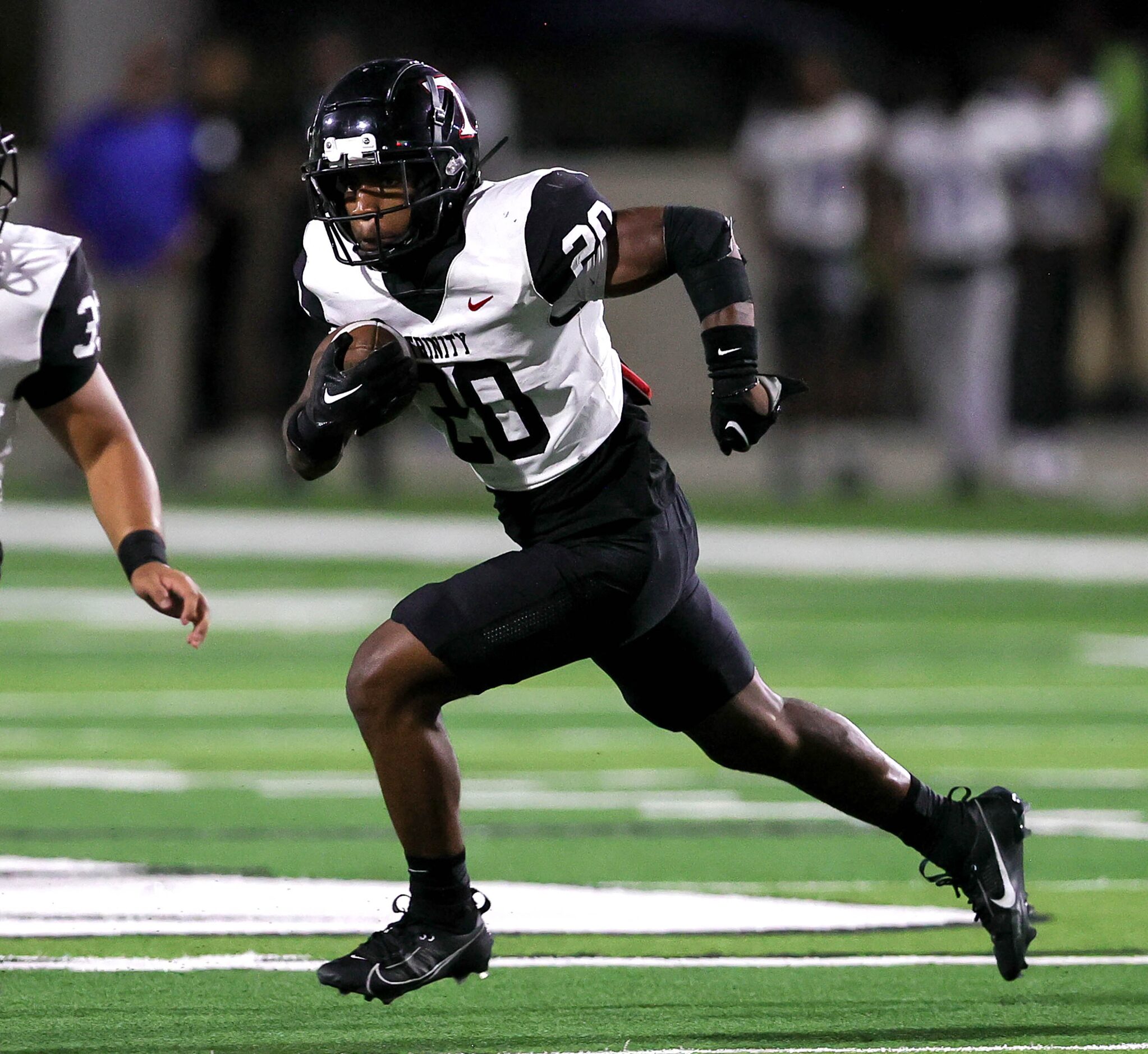 Euless Trinity running back Josh Bell looks for a hole to run against North Crowley during...