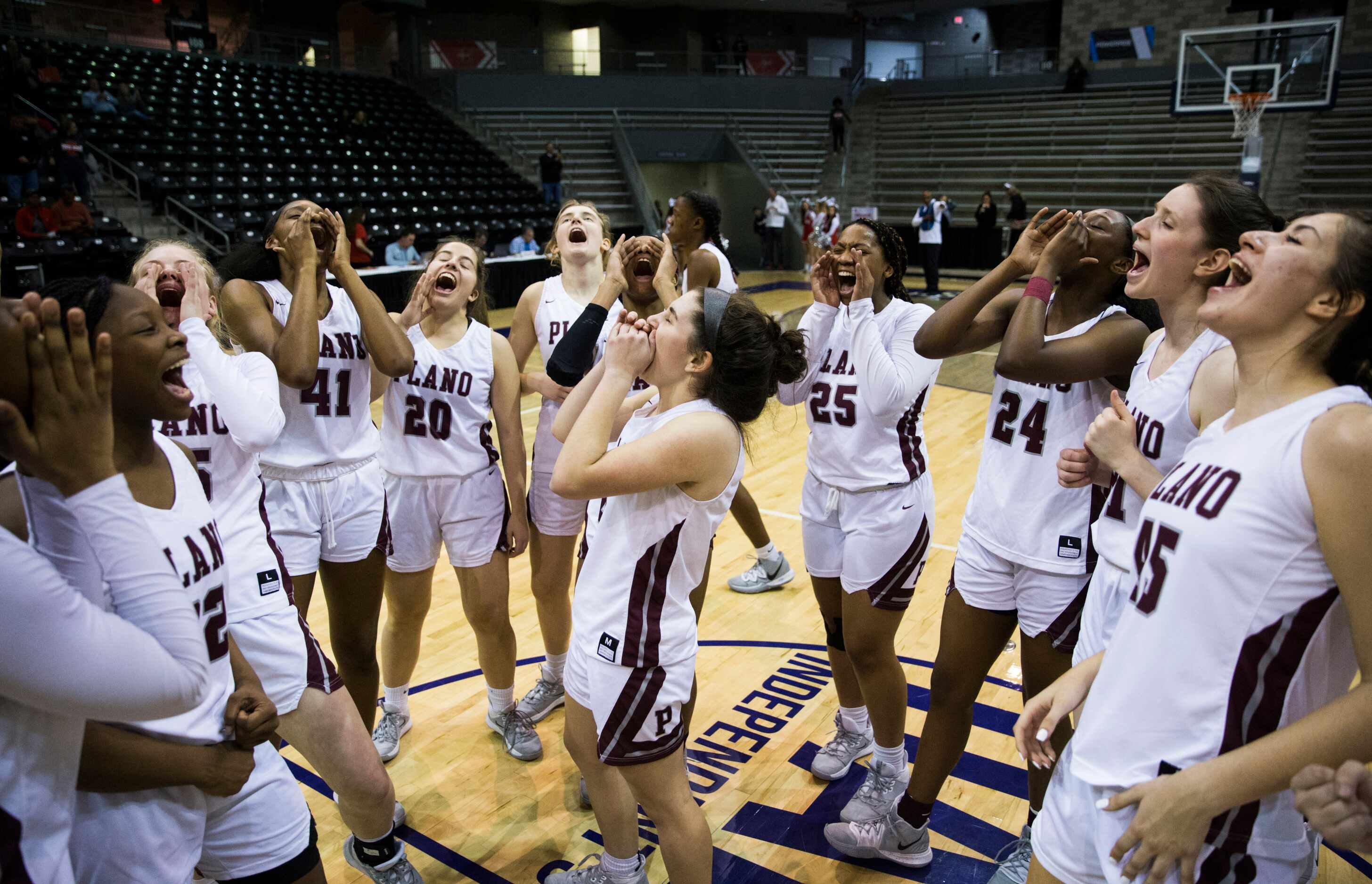 Plano celebrates a 60-46 win after a UIL 6A Region II semifinal girls basketball game...