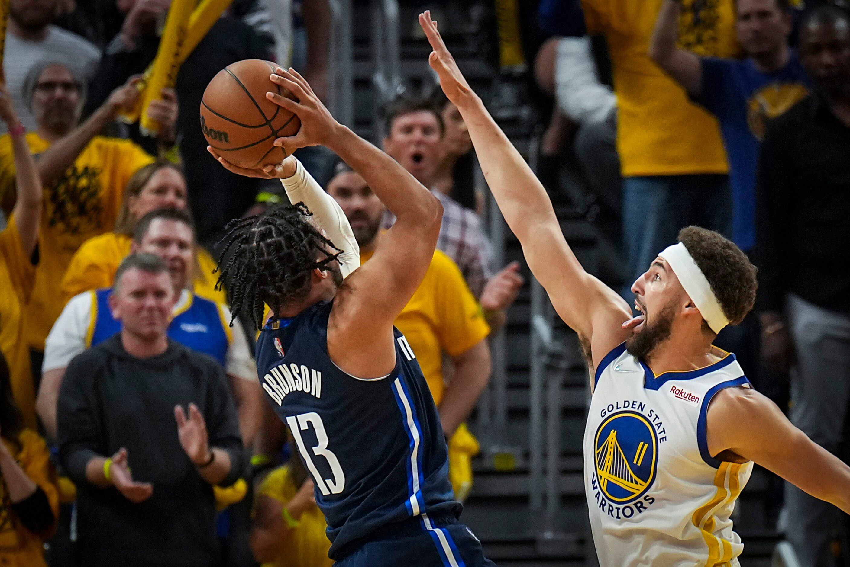 Dallas Mavericks guard Jalen Brunson (13) shoots as Golden State Warriors guard Klay...