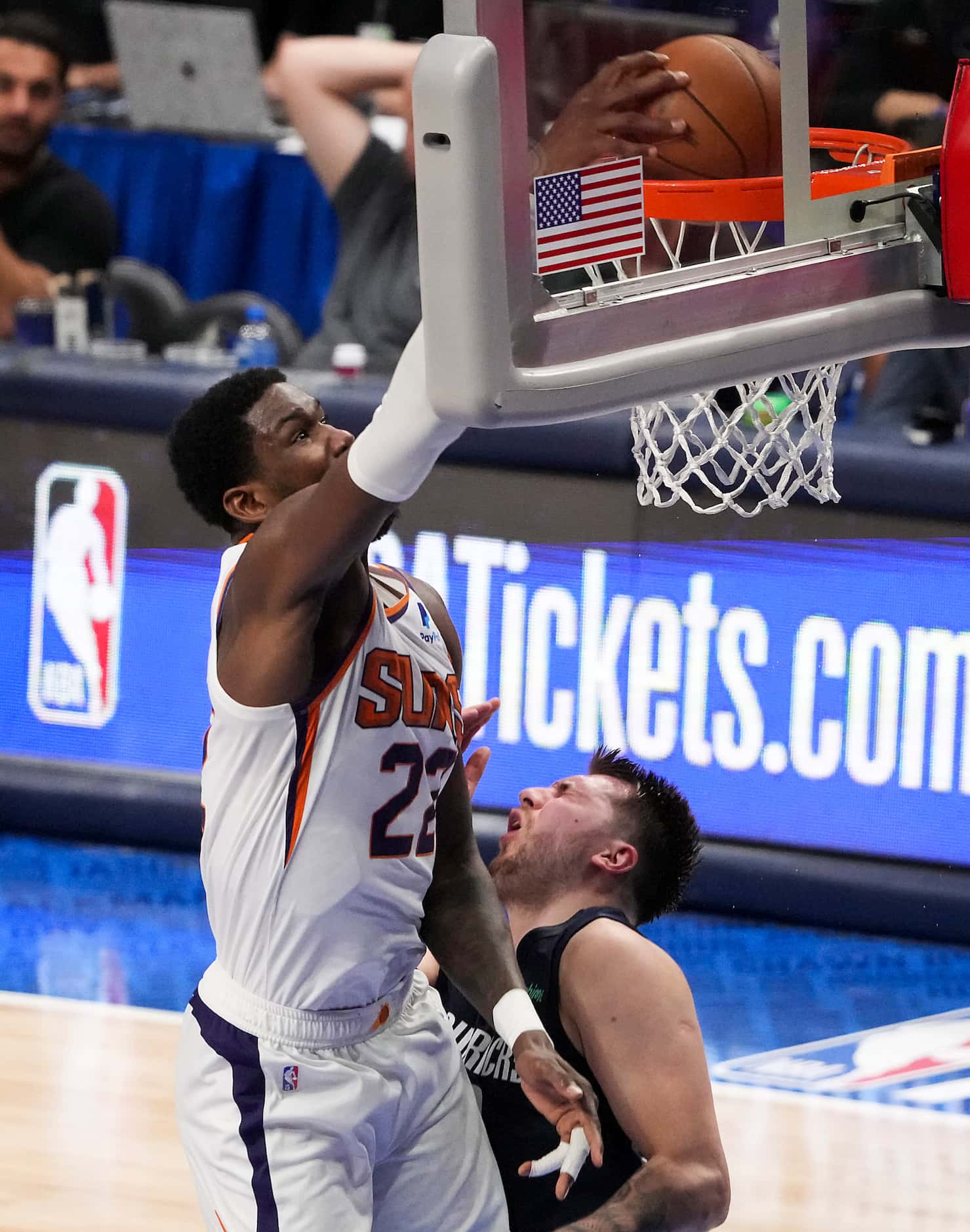Phoenix Suns center Deandre Ayton (22) dunks the ball past Dallas Mavericks guard Luka...