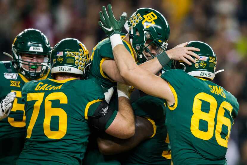 Baylor Bears quarterback Charlie Brewer (12) celebrates a touchdown with his team during the...