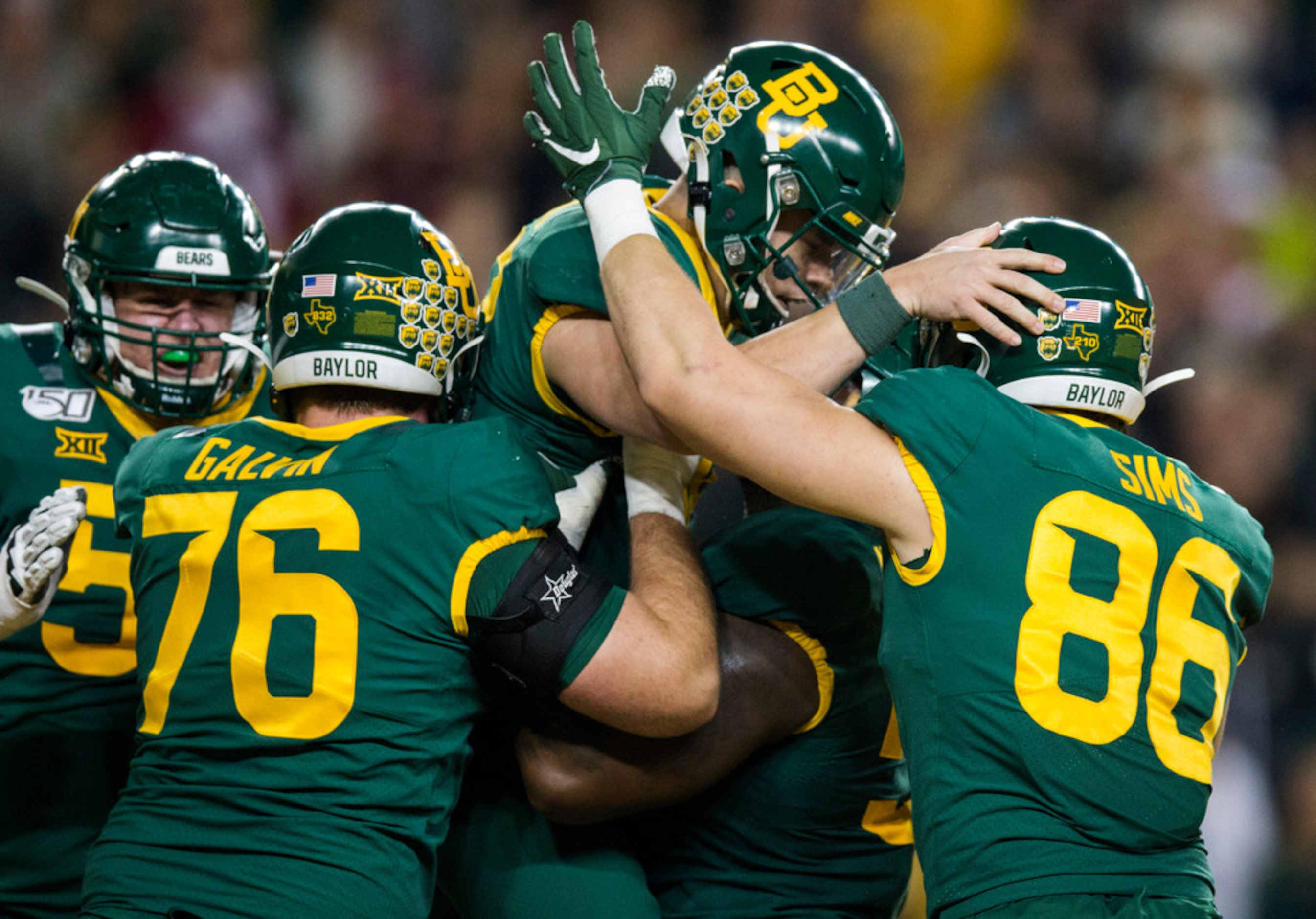 Baylor Bears quarterback Charlie Brewer (12) celebrates a touchdown with his team during the...