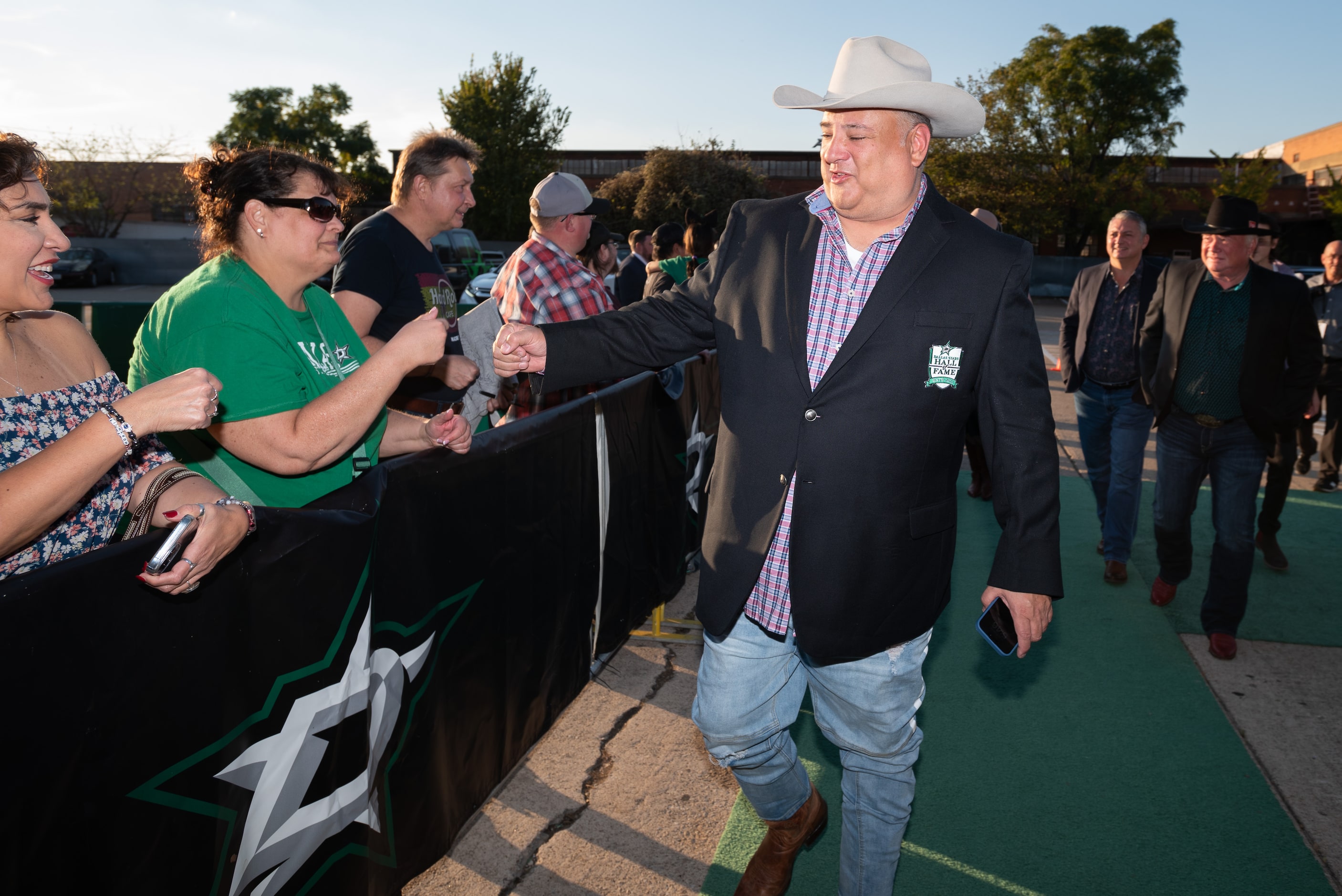 Dallas Stars owner Tom Gaglardi greets fans as he arrives for the Stars' Hall of Fame Gala...