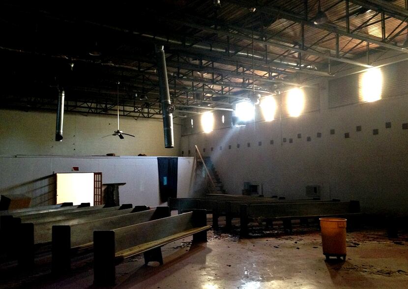 Inside the old gymnasium that, for a while, served as the main sanctuary of a church that...