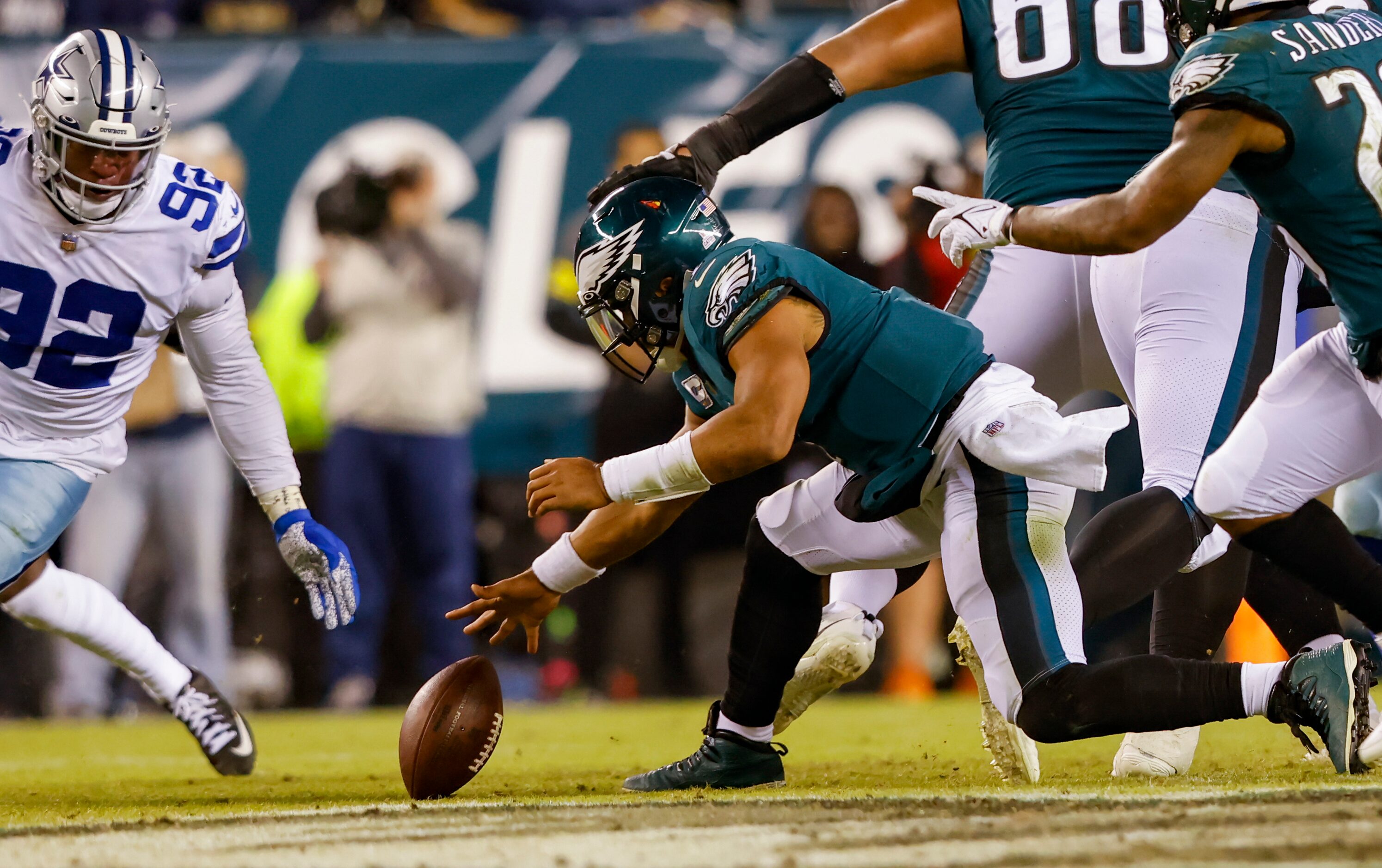 Dallas Cowboys defensive end Dorance Armstrong (92) reaches for a fumble by Philadelphia...