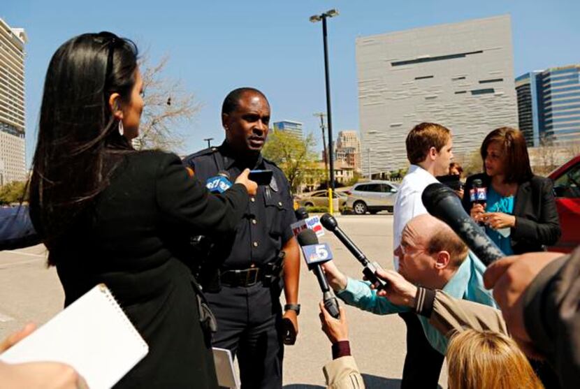 
Dallas police Sgt. Warren Mitchell briefed the media during the standoff.
