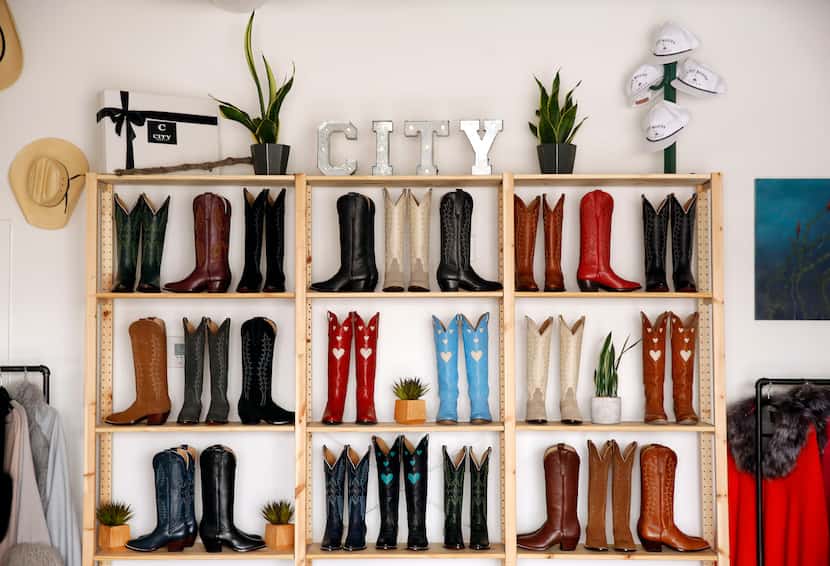 Lizzy Chesnut Bentley's handcrafted cowboy boots are on display at her City Boots store in...