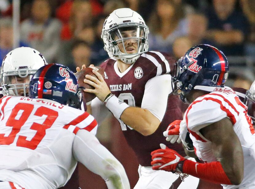 Texas A&M Aggies quarterback Jake Hubenak (10) looks for a receiver in the third quarter...