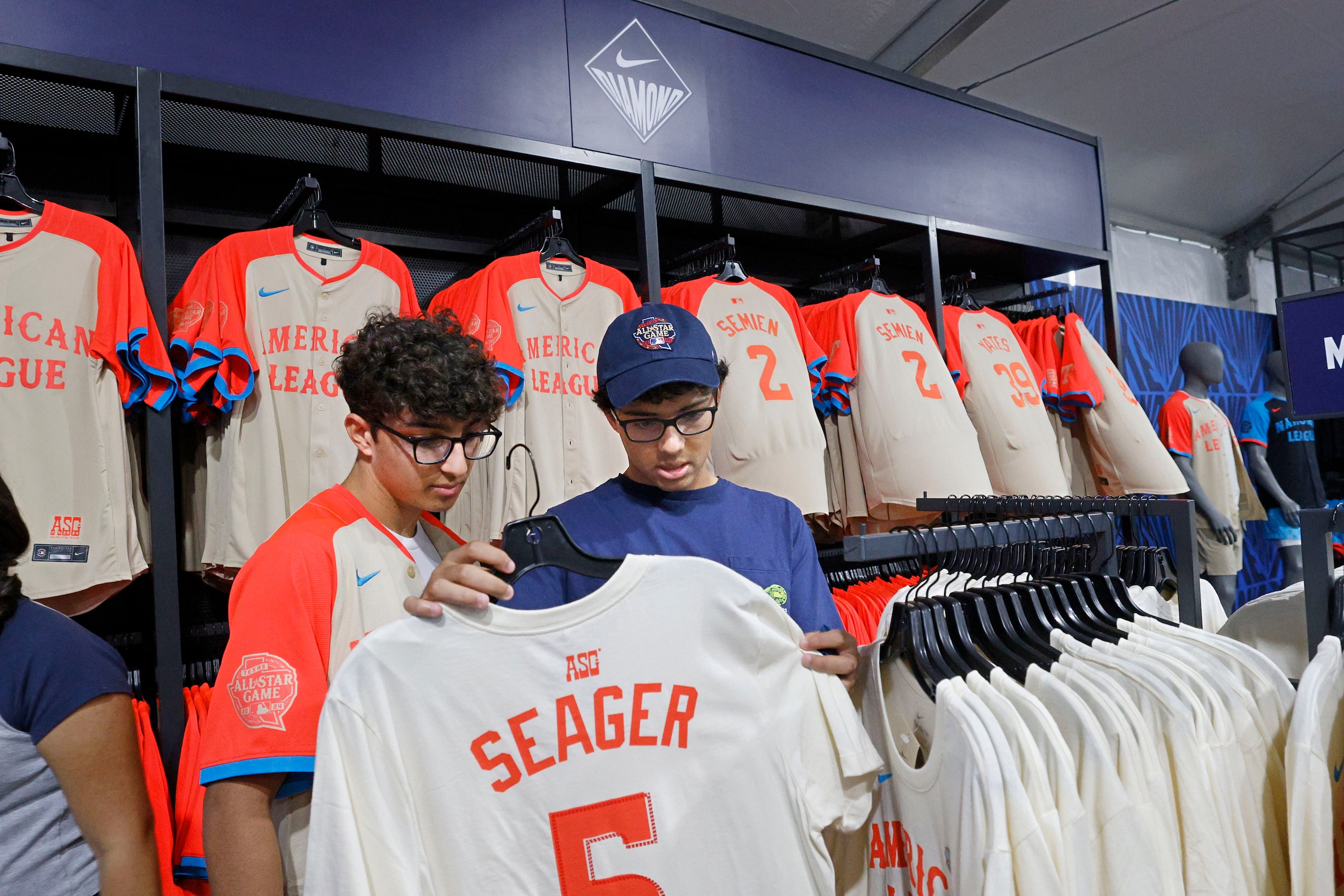 Make-a-Wish kid Devan Huber , 16, of Demarest N.J., left, shops with his brother Avi Huber,...