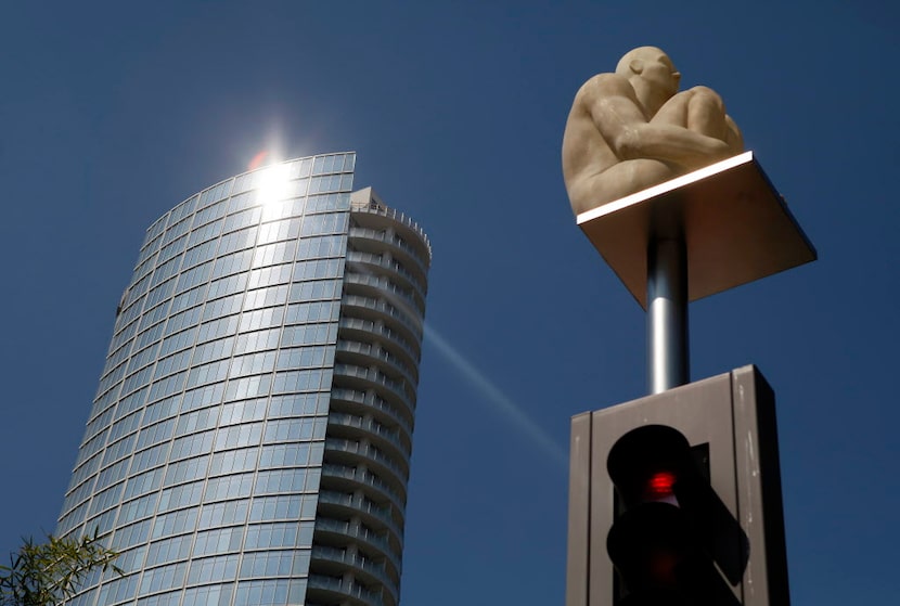 Light reflects off Museum Tower as seen just outside the Nasher Sculpture Center in Dallas. 