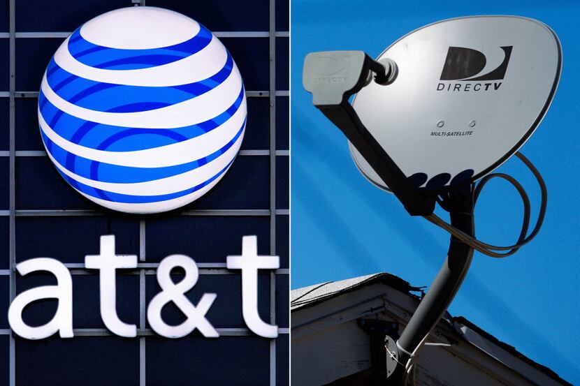 FILE - This file combo made from file photos shows the AT&T logo on the side of a corporate...