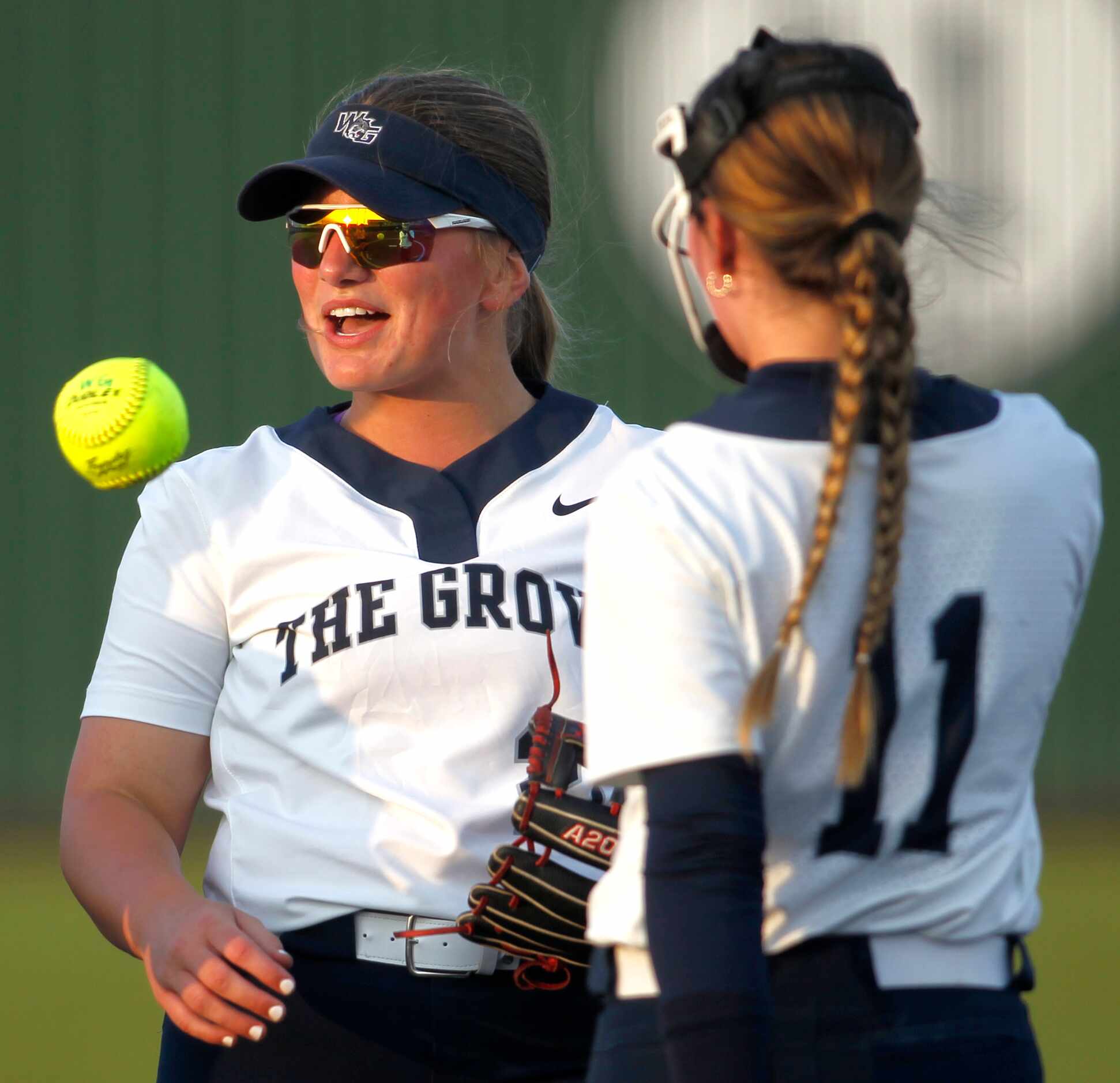 Prosper Walnut Grove 2nd baseman Kailee James (20), left, reacts after tagging out a Frisco...