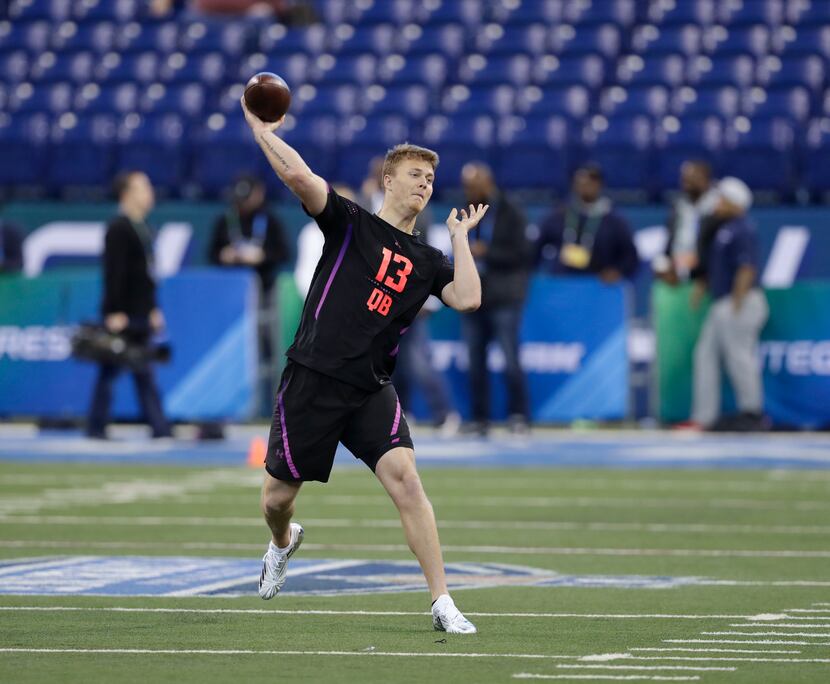 Marshall quarterback Chase Litton throws during a drill at the NFL football scouting...