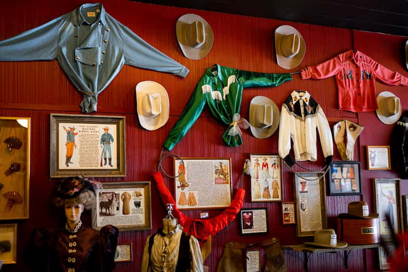 Western wear hangs on display at the Cowgirls of the West Emporium in Cheyenne, Wyo. The...