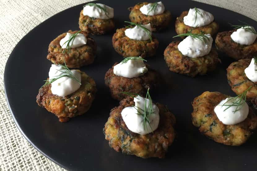 Greek-style zucchini fritters with lemony yogurt sauce. What sets them apart is crumbled...