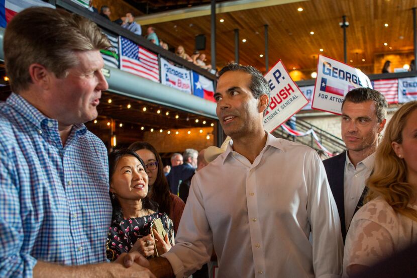 George P. Bush shakes hands with a supporter after holding a Campaign Kick-Off to announce...