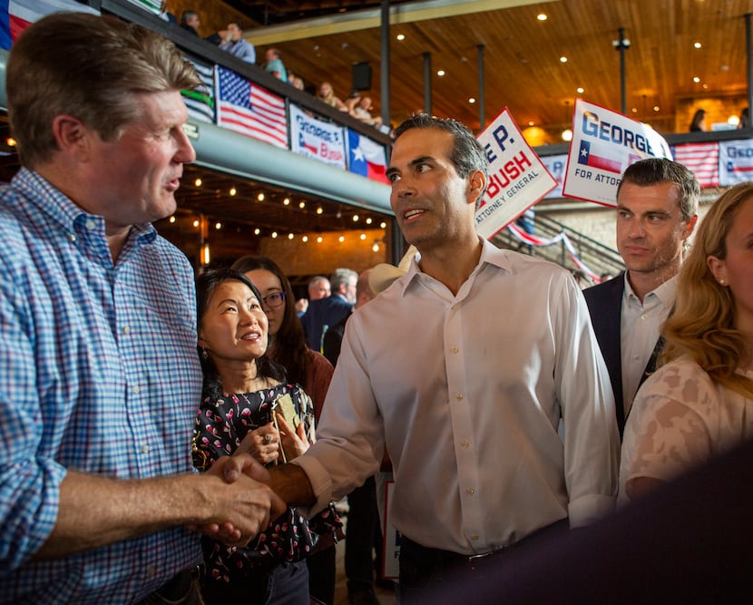 George P. Bush shakes hands with a supporter after holding a Campaign Kick-Off to announce...